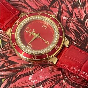 Ecclissi watch with a red genuine leather strap and a crystal-studded bezel.
